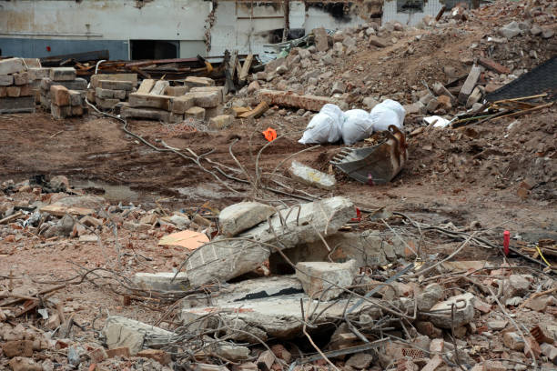 istock Bricks, garbage, an excavator bucket, fittings, etc. are scattered on the construction site 1464856421