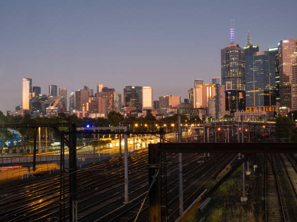 istock City skyline and train tracks at sunrise 1464865969
