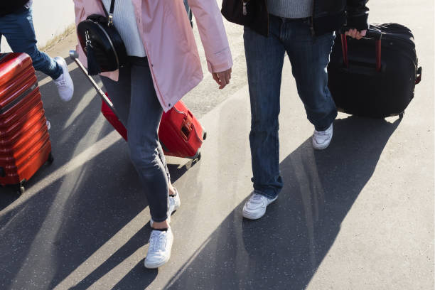 istock people on the move with wheeled suitcases 1464872851