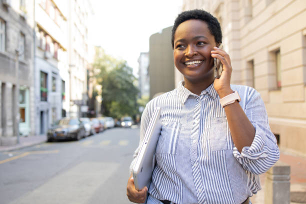 istock Happy young woman using phone 1464873600