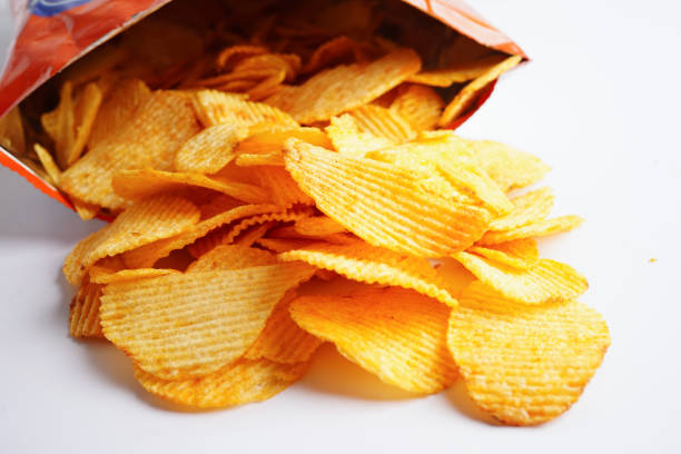 istock Potato chips in open bag, delicious BBQ seasoning spicy for crips, thin slice deep fried snack fast food. 1464876246