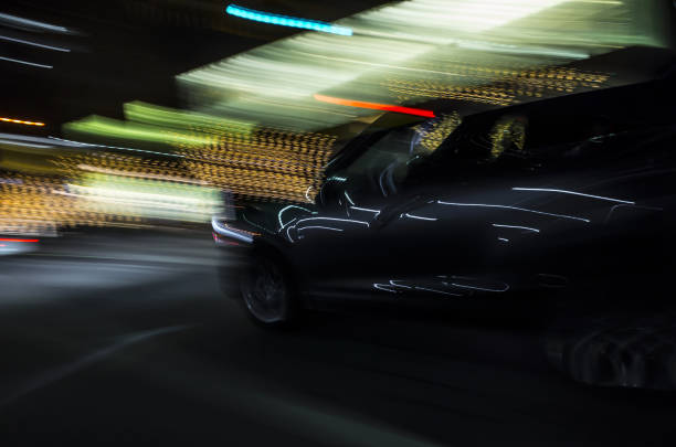 istock CAR AT NIGHT IN MOTION BLUR 1464877487