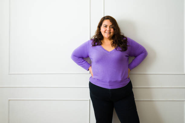 istock Beautiful obese woman posing while smiling 1464879813