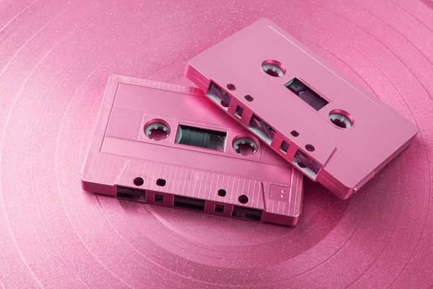istock Vintage audio cassette and vinyl record. Analog data 1464879999