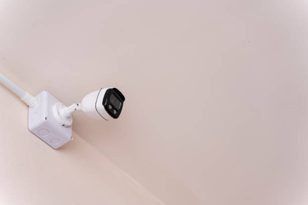 istock Smart CCTV camera on the wall with blue lights. Cameras work day and night, Record a video in a public place. Protection from thieves 1464881455