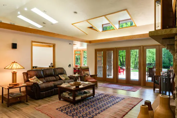 Light filled Great room with clerestory windows tucked into the vaulted ceiling in this Prairie Style home, Farmington, Pennsylvania, USA
