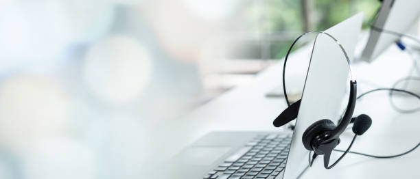 istock Headset and customer support equipment at call center ready for actively service . Corporate business help desk and telephone assistance concept . 1464890882