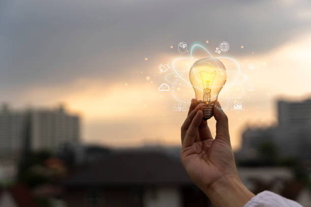 istock Businessman holding light bulb. Symbol of innovation and network connection, Cloud computing technology. Business strategy and development. 1464891104