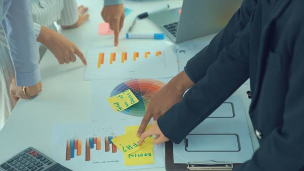 istock Business people proficiently discuss work project on meeting table . Corporate business team collaboration concept . 1464892749