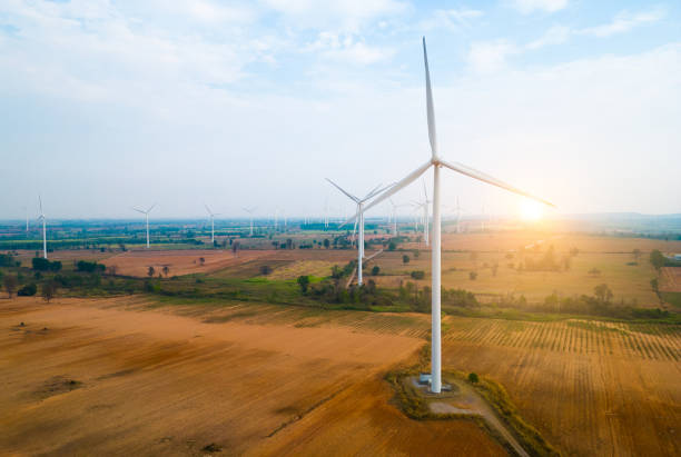 istock farm Wind turbines generate electricity from wind energy. 1464907420