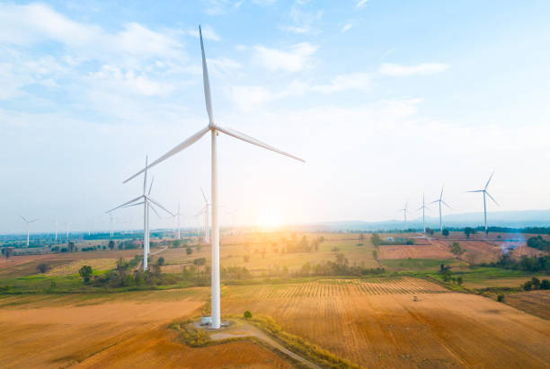 istock farm Wind turbines generate electricity from wind energy. 1464907944