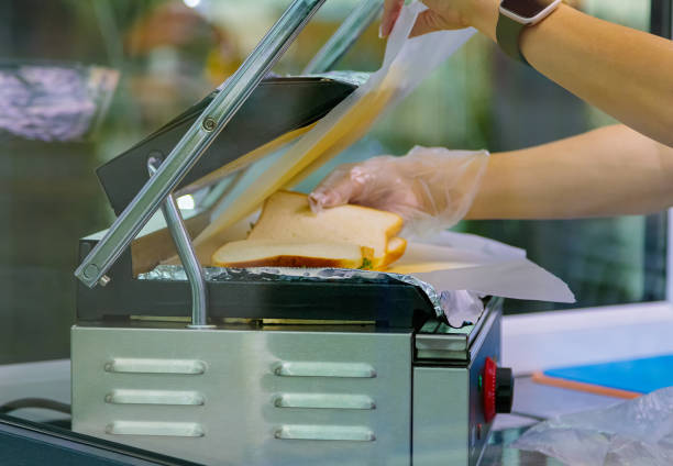 istock Grilling sandwiches on an electric grill. 1464915702
