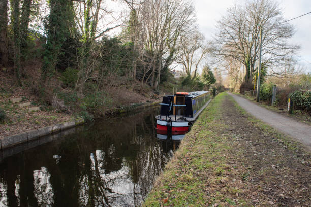 istock Narrowboat moored on a British canal in rural setting 1464916647