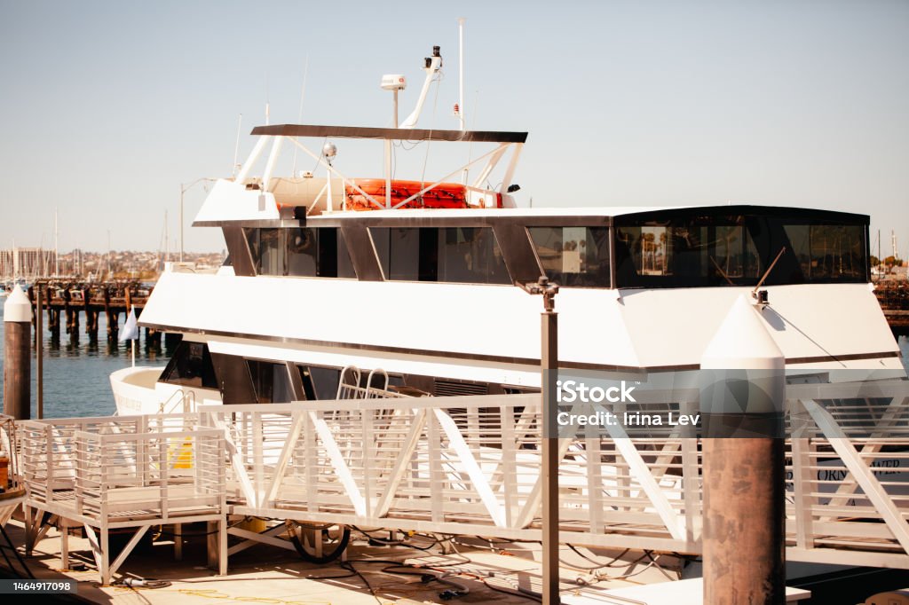 CLose up of white cruise boat parked in matina, CIty with bay views and small cruise ships Atlantic Ocean Stock Photo