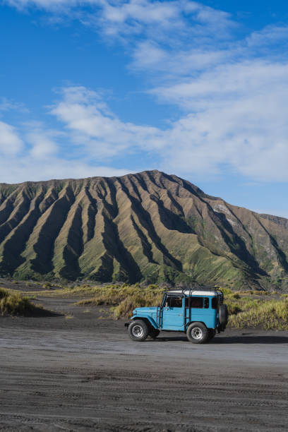istock Blue off-road with green hills 1464919805