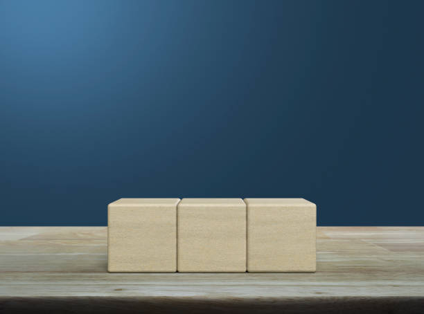 istock Three block cubes on wooden table 1464926161