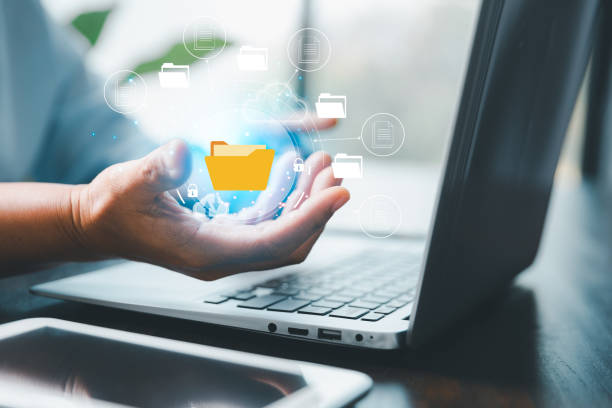 istock Concept of online document management technology. Businesspeople manage corporate databases through cloud, cyberspace technology and large, paperless archives of important, file and online storage. 1464926600