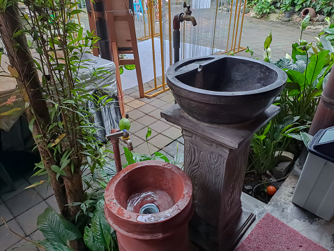 Two Hand Wash basin in a row for kid and adult in the terrace with plants arounds