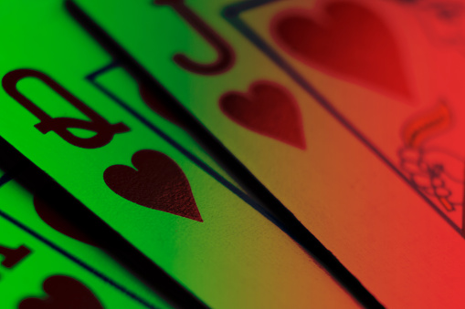 Playing cards isolated on color background. Hand of playing clubs cards isolated.