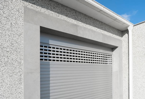 istock Roller shutter gate. Metal roller garage door as background. Automatic electric roll-up garage gate. Garage with rolling gates. 1464934380