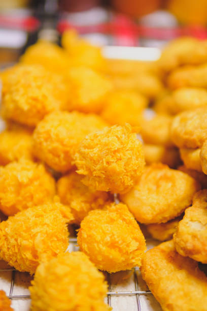 istock Crispy breaded mozzarella cheese, cheese ball, blurred background 1464935968