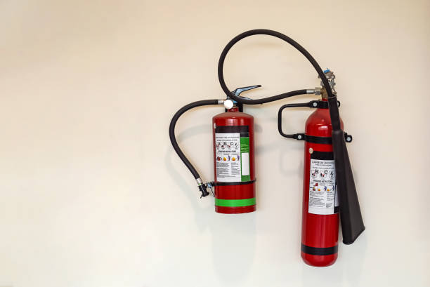 istock Fire extinguisher and gas pump system on the wall. Powerful emergency fire extinguisher equipment. Fire retardant. Fireproof. 1464939127