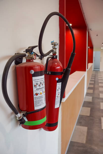 istock Fire extinguisher and gas pump system on the wall. Powerful emergency fire extinguisher equipment. Fire retardant. Fireproof. 1464939129