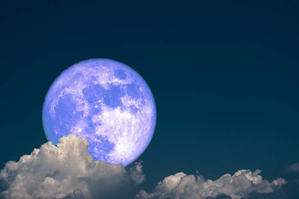 istock Full Snow Moon back dark gray cloud on the night sky 1464939194