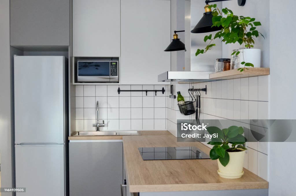 Modern Stylish Scandinavian Kitchen Interior With Kitchen Accessories  Bright White And Grey Kitchen With Household Items In Studio Apartment  Stock Photo - Download Image Now - iStock