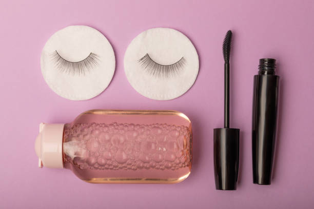 istock Micellar water for removing makeup, cotton pads and mascara on a bright colored background. MAKE-UP REMOVAL. Tonic, serum or lotion. Skin care. Beauty concept.FLETLEY.Top view. copy space 1464941760