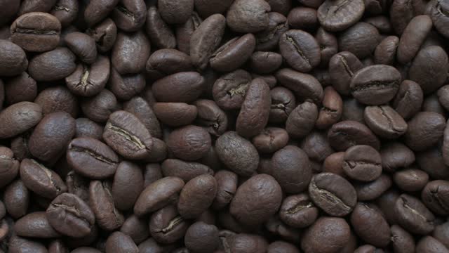 View on coffee from one side to another, coffee texture video 4k.