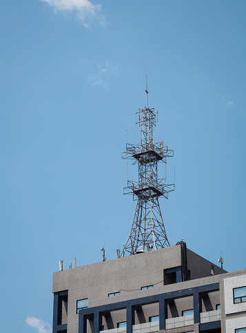 Signal communication tower on the roofs of building