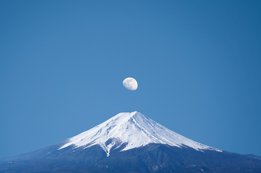 A stunning view of the moon over Mt. Fuji, Lake Kawaguchi, Fujikawaguchiko Japan
