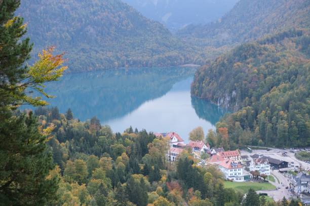 istock Scenic view with mountains in the background, trees, and lake 1464950767