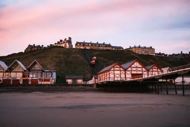 A beautiful view of the beach and the pier of Saltburn at sunset