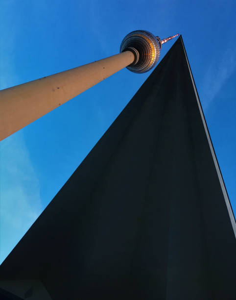 istock Low angle shot of Fernsehturm Berlin with a silhouette of triangular structure 1464951468