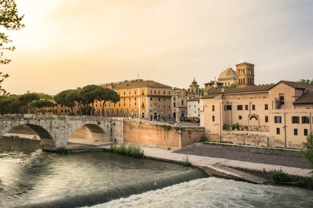 istock River Tiber surrounded by buildings under a cloudy sky in Rome, Italy 1464951697