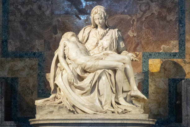 Pieta in the Saint Peter's Basilica under the lights in Vatican City The Pieta in the Saint Peter's Basilica under the lights in Vatican City pieta stock pictures, royalty-free photos & images