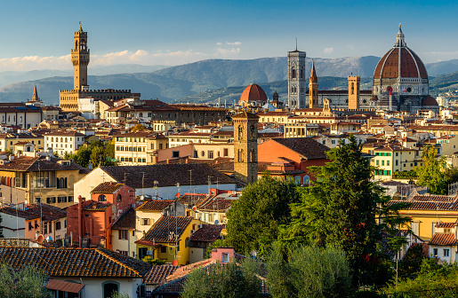 The Florence cityscape with the Palazzo Vecchio and the cathedral with the blue sky.