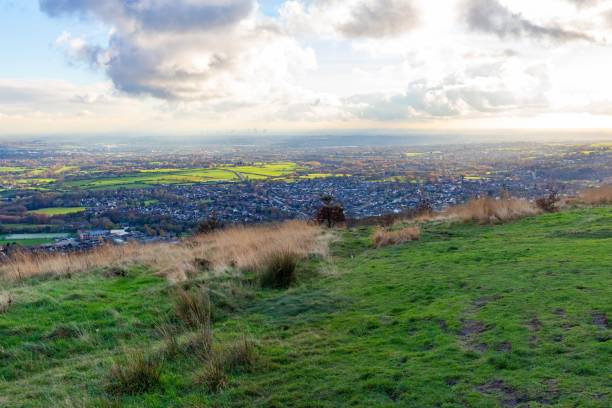 istock Green landscape with village view and meadows under cloudy sky 1464953752