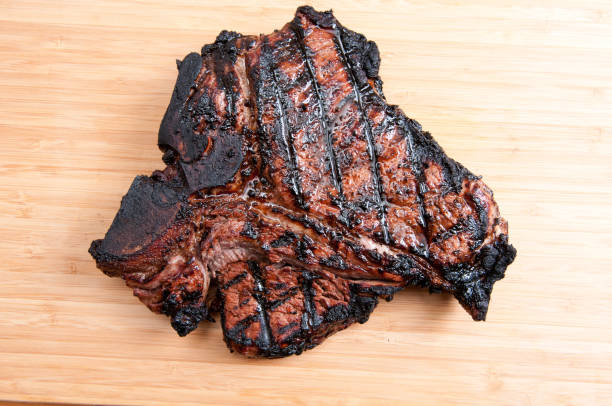 grilled t-bone steak with fresh vegetables ready to eat