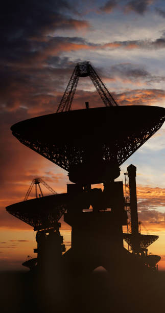 istock Satellite dishes against the colored clouded sky 1464957203