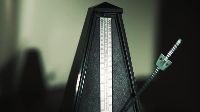 Pendulum swings on metronome