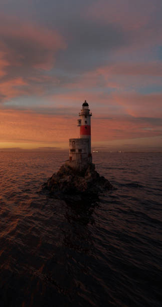 istock Romantic seascape with a lighthouse in open waters for a stylish screen saver 1464959140