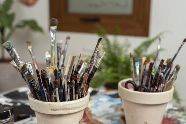 istock Selective focus shot of painting brushes in the art studio 1464959183
