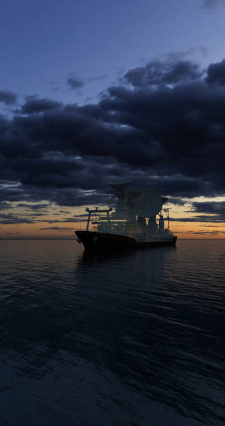 Scientific ship with satellite dishes sailing in open waters at night