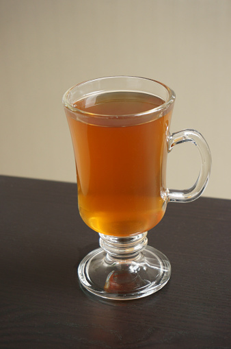 Hot tea standing on a wooden table