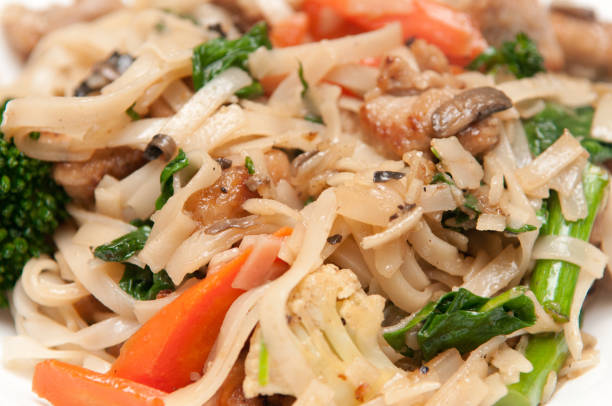 istock Noodles with carrot, mushrooms, and broccoli 1464959830
