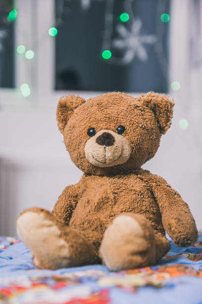 istock Vertical closeup shot of a cute teddy bear 1464960348