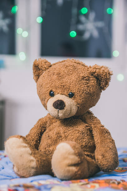 istock Vertical closeup shot of a cute teddy bear 1464960352